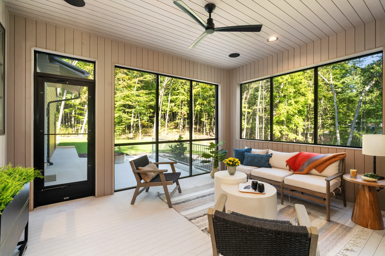 Screened porch, glazed on three sides to the woods