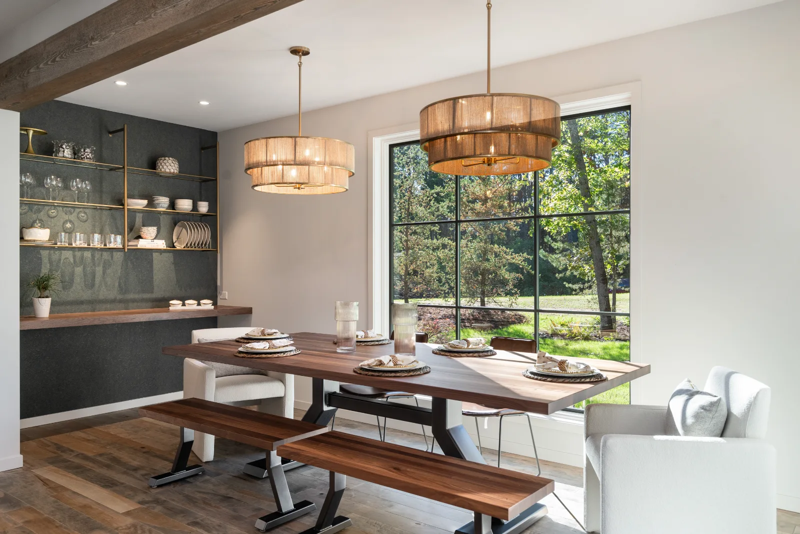 Dining room, tall window framing the tree line