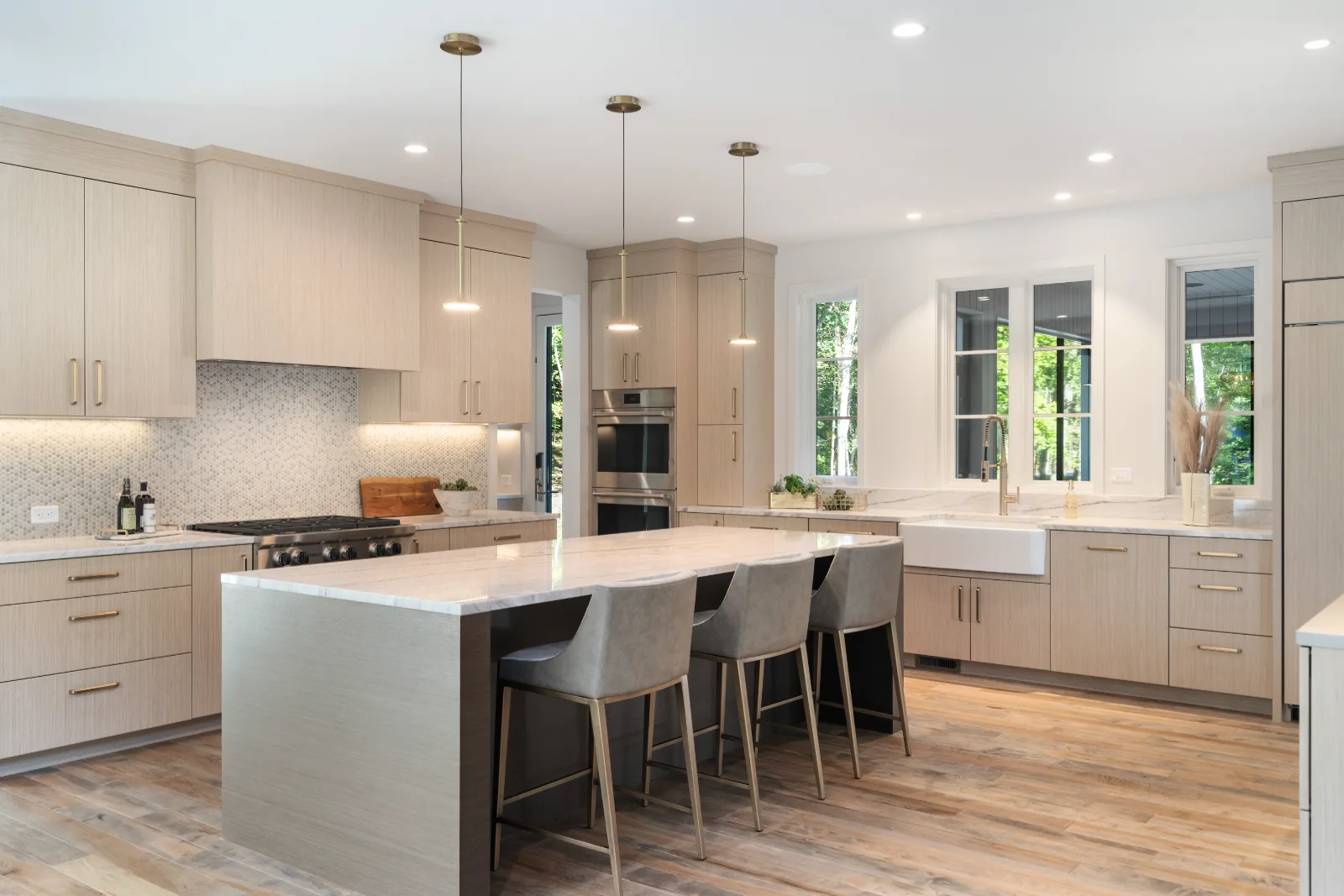 Kitchen, island and windows to the woods